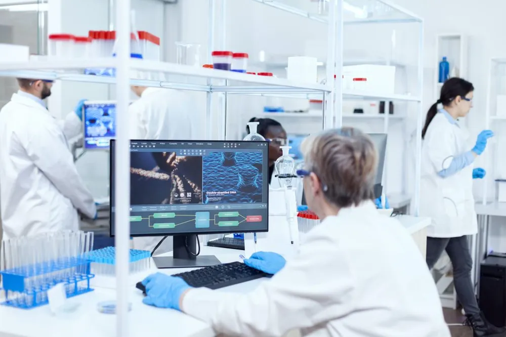 Senior scientist reviewing genetic research data in a pharmaceutical laboratory